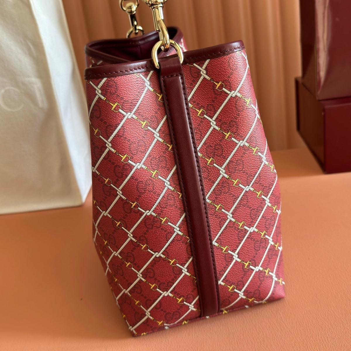 GUCCI 26S  EMBLEM BUCKET BAG 25 IN DARK RED COATED FABRIC